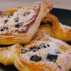 blueberry danishes sitting on a plate